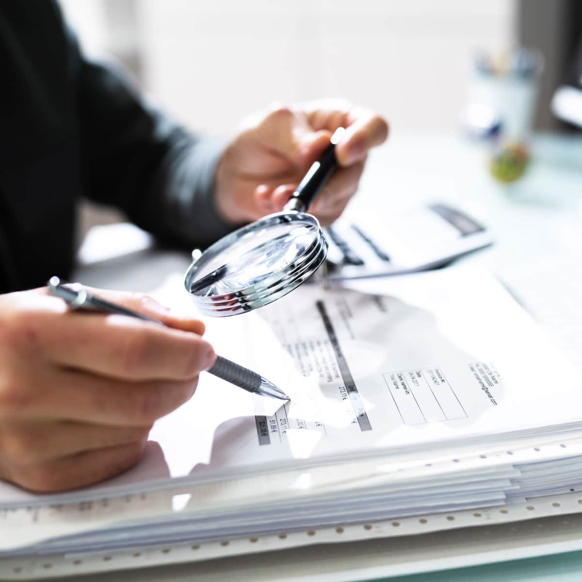 A person reviewing documents to ensure a temporary cleanroom is meeting compliance specifications